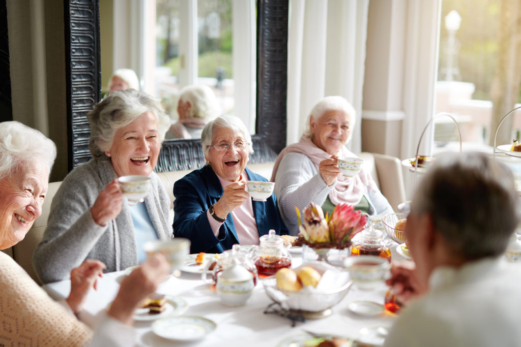 Cropped shot of a group of seniors having tea in their retirement home
